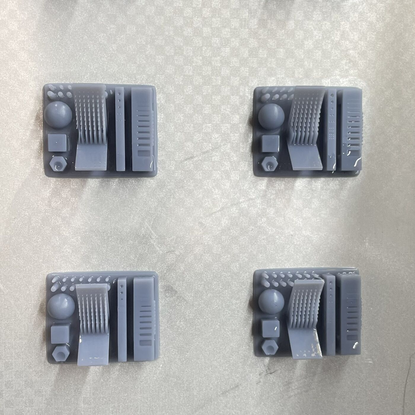 SLA resin test prints arranged on the build plate